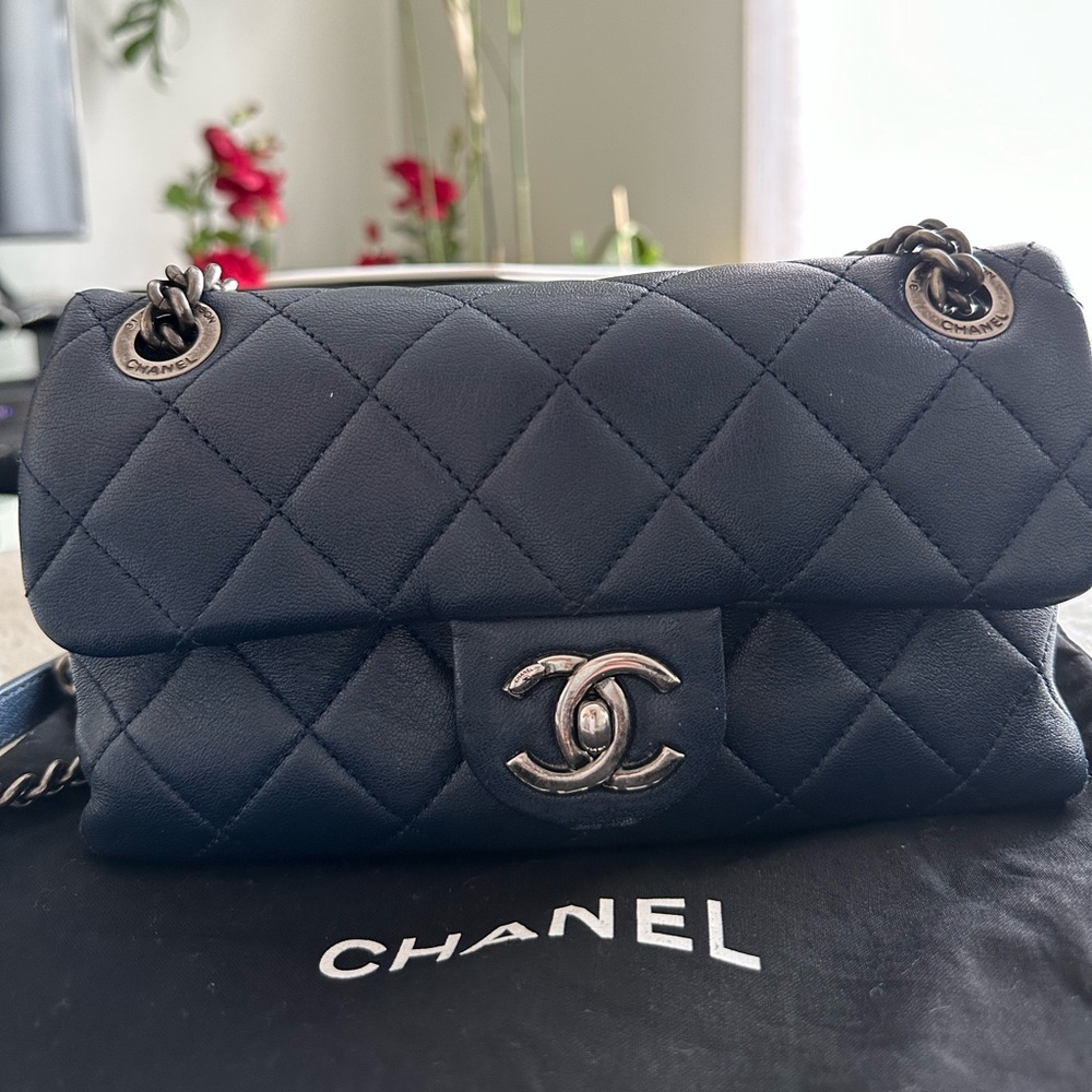 Chanel mini quilted flap bag limited edition in dark blue color.